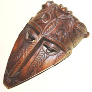 Imposing hand-carved solid wood African mask